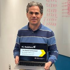 Daniel Gottesman holding a Reddit AMA sign. 