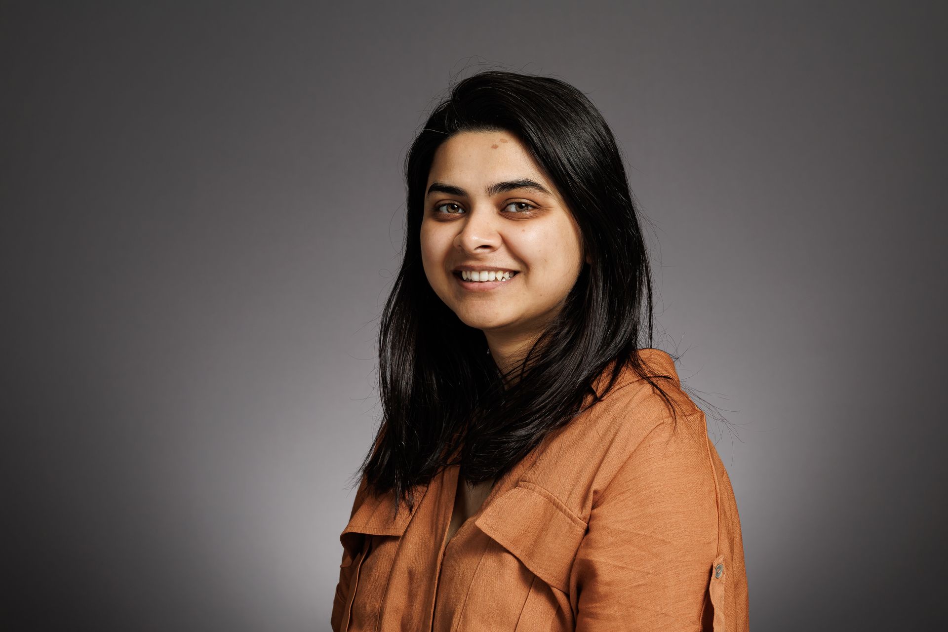 A professional headshot of a woman