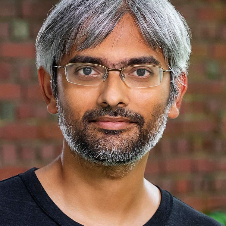 Professional headshot of a man. 