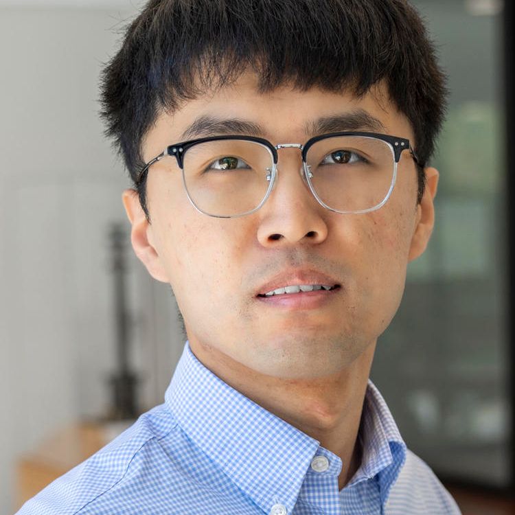 Professional headshot of a man. 