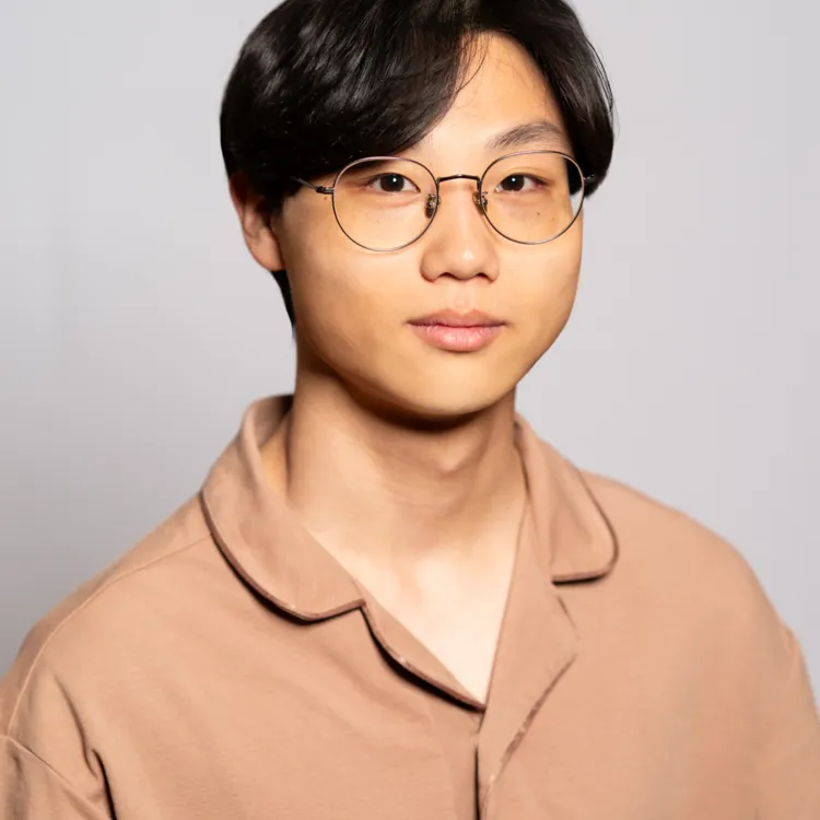 Professional headshot of a man. 