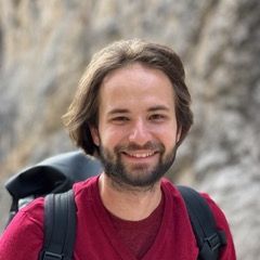 a photo of a man wearing a red shirt